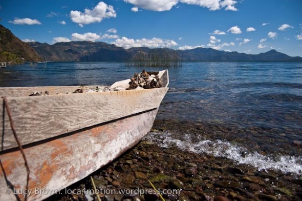 Abandoned canoe on edge of lake, Christmas Eve, Lago de Atitlán, Guatemala