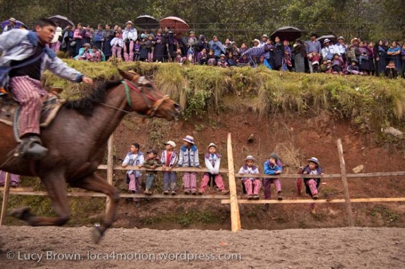 Spectators in the rain. Skach Koyl horse race, Todos Santos Cuchumatán, Huehuetenango, Guatemala