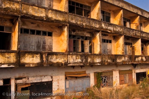 Sunset lit derelict buildings along the Mekong riverbank, Vientiane, Laos
