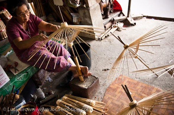 Fixing bamboo spokes to make parasol frames, traditional Thai parasols, Chiang Mai, Thailand