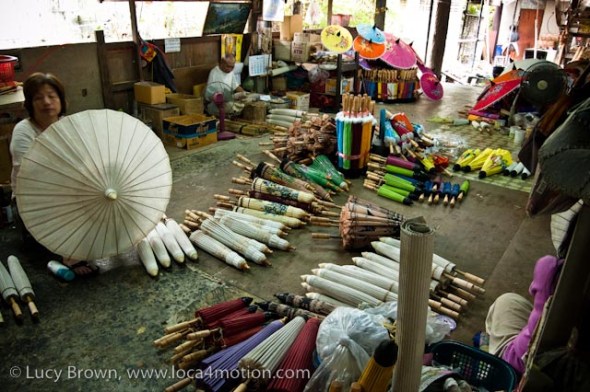 Artisans at work in parasol workshop, traditional Thai parasols, Chiang Mai, Thailand