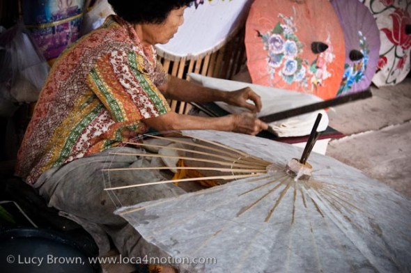 Close-up of glueing sa paper to parasol frame, traditional Thai parasols, Chiang Mai, Thailand