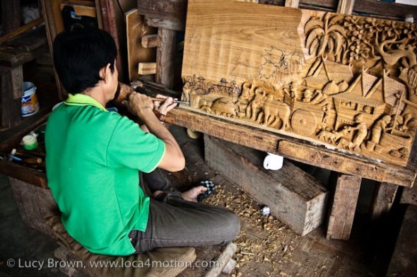 Carving a rural Thai scene in teak, wood carving, Chiang Mai, Thailand