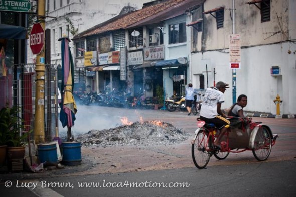 Festival fire in street outside Kong Hock Keong or Goddess of Mercy Temple, George Town, Penang, Malaysia