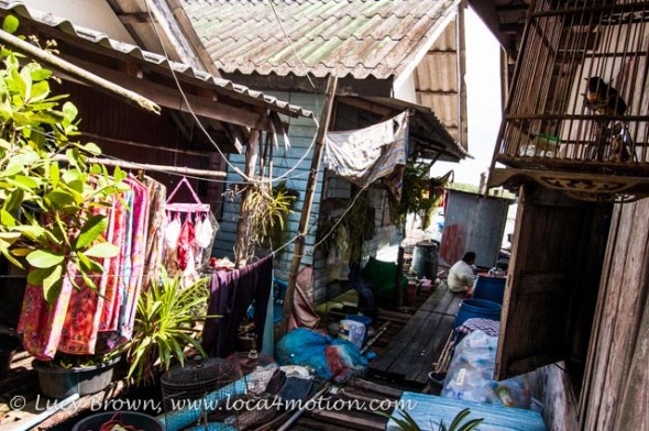 Washing line, bird cage & life between floating houses, Koh Panyee (Ko Panyi), Phang Nga Bay, Thailand
