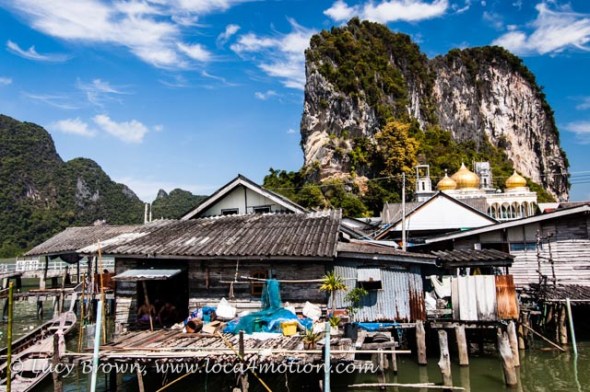 Houses on stilts, mosque and limestone karsts, view from Koh Panyee School (Ko Panyi), Phang Nga Bay, Thailand Houses on stilts, mosque and limestone karsts, view from Koh Panyee School (Ko Panyi), Phang Nga Bay, Thailand